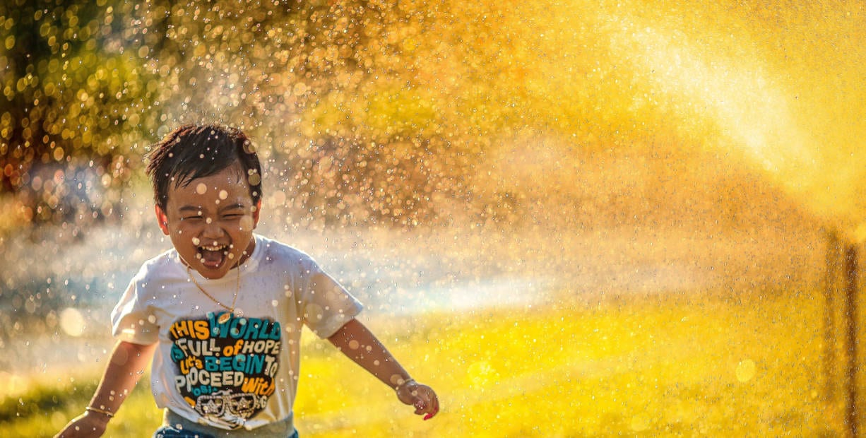 Boy Running Through Rain