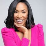 Black woman in pink jacket